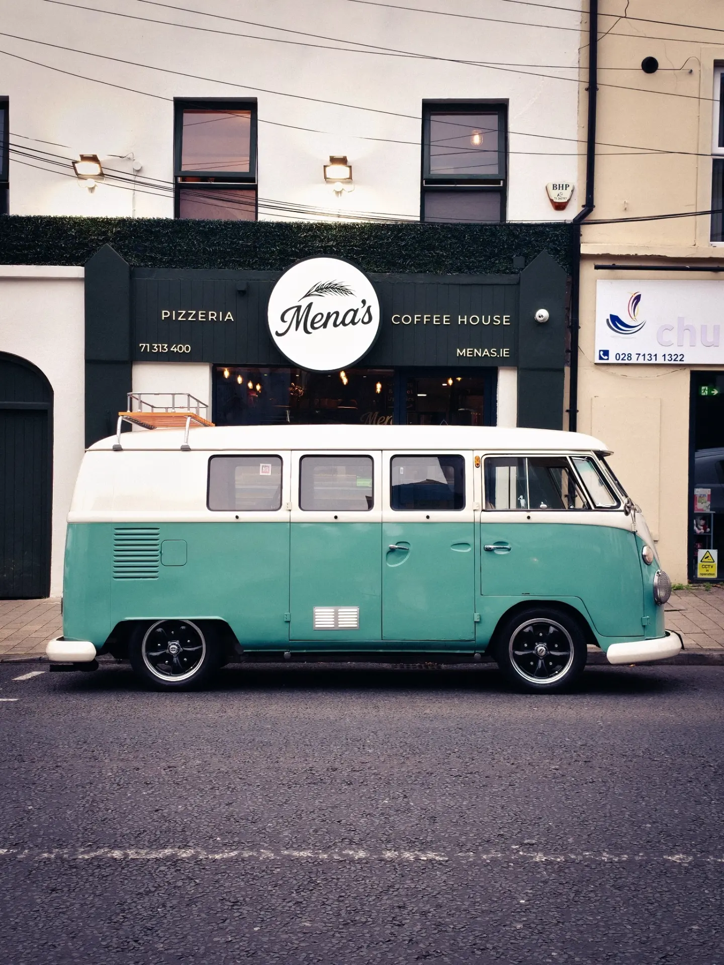 A vintage campervan parked outside Mena’s in an archive photograph